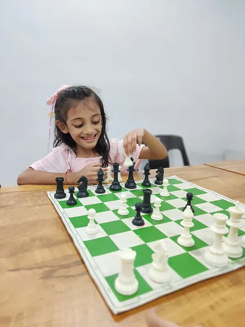 A girl smiling as she makes her move