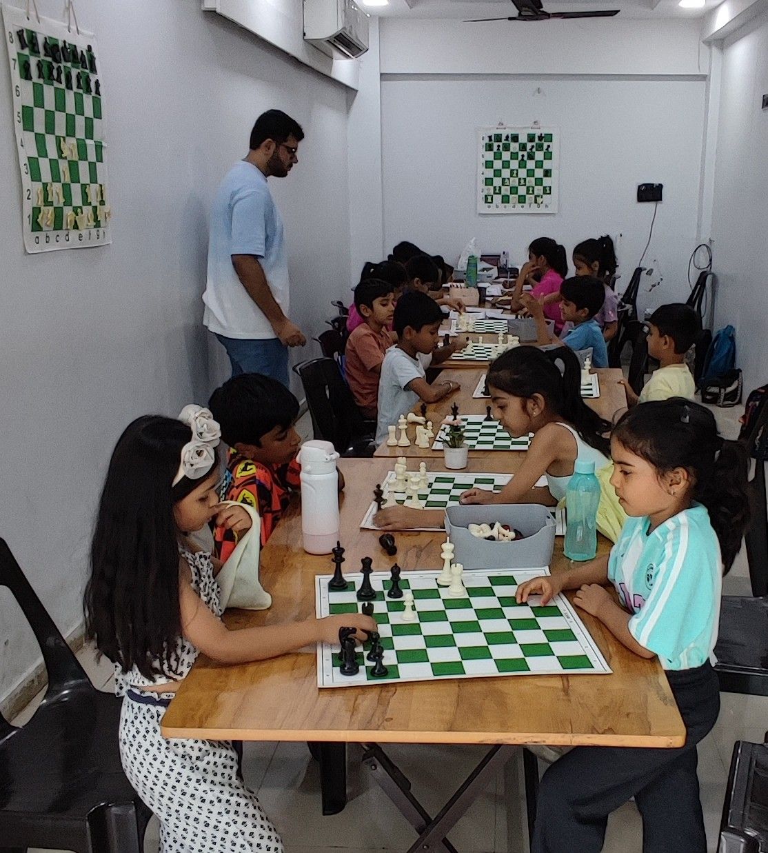 Students learning chess at Surat Chess Club in Vesu, Surat