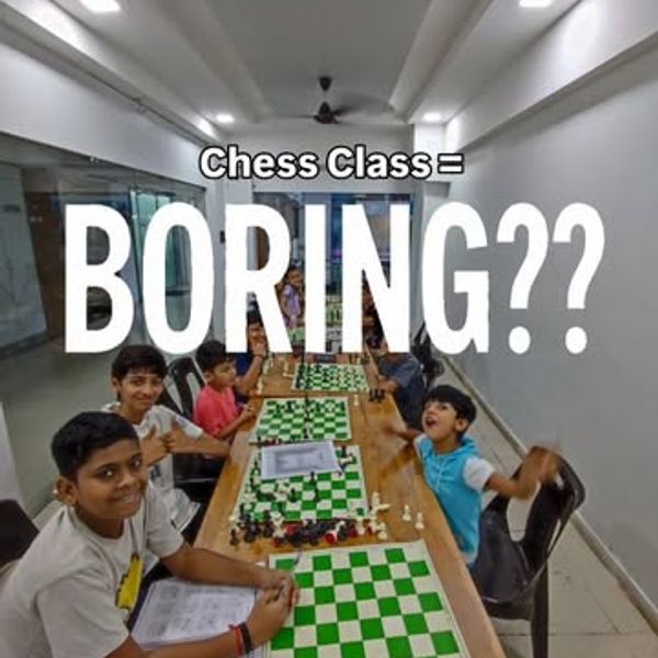 Young students smiling over their chess boards during a class at Surat Chess Club